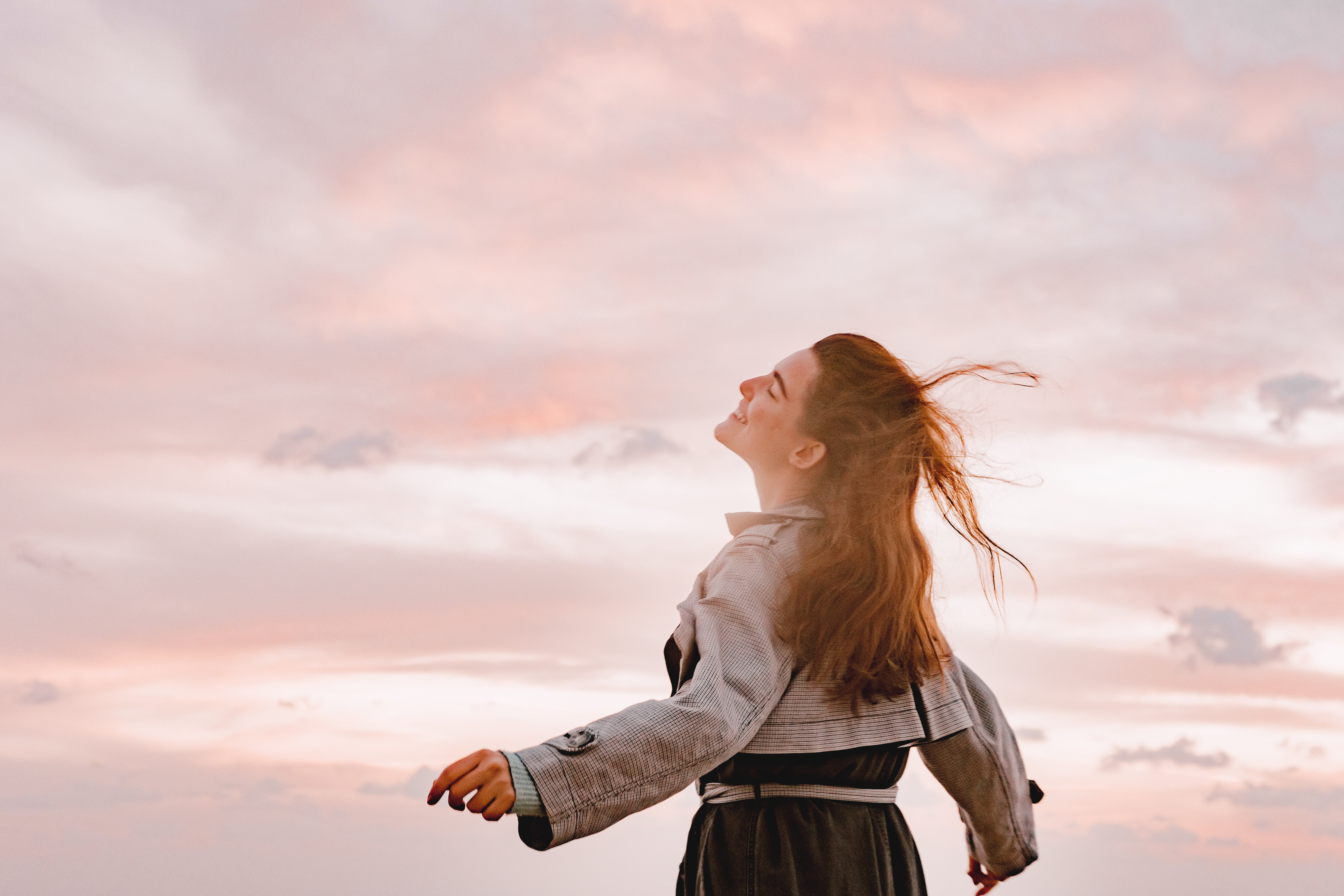 happy woman arms outstretched